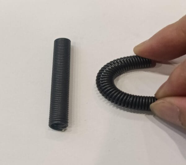 smart nitinol coil spring under heat activation